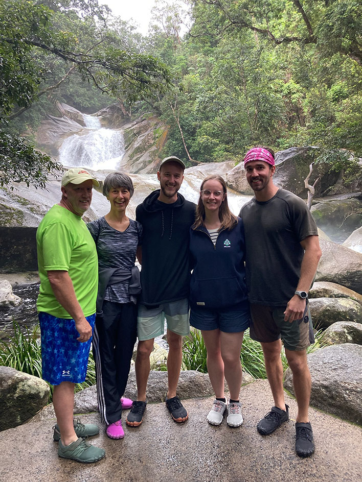 Family in front of a waterfall